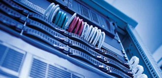 A close-up view of high-speed fiber links inside a data center cabinet.
