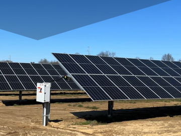 Solar panel arrays in sandy fields with combiner box units  
