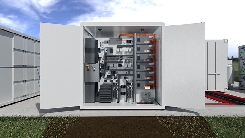 A group battery energy system storage container with an open door showing the wire termination, cabling, products and mechanisms all inside 