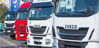 Front of trucks aligned at an angle with Iveco name on them