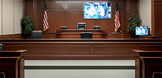 courtroom with video monitor at the front of the room
