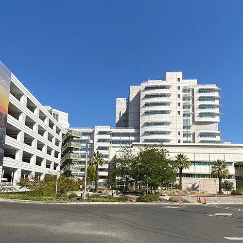 Hospital building for UC Davis Health with parking garage