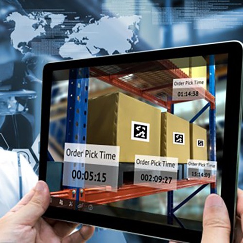 Hands holding a tablet showing boxes stacked on shelving and pick time metrics
