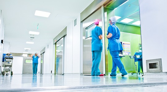 healthcare workers in the hallway of a hospital